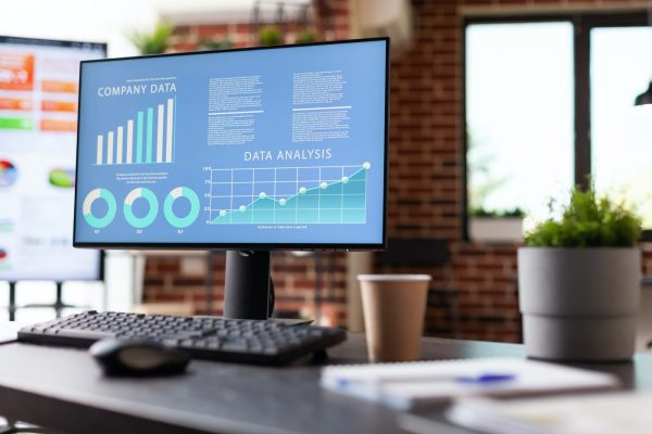 Monitor with charts with annual data analysis on screen